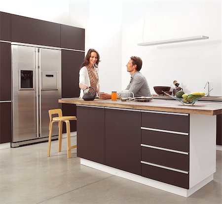 couple in the modern kitchen interior design photo Foto de stock - Super Valor sin royalties y Suscripción, Código: 400-07294658