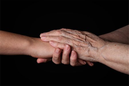 granddaughter and grandmother holding hands, support theme Stock Photo - Budget Royalty-Free & Subscription, Code: 400-07294758