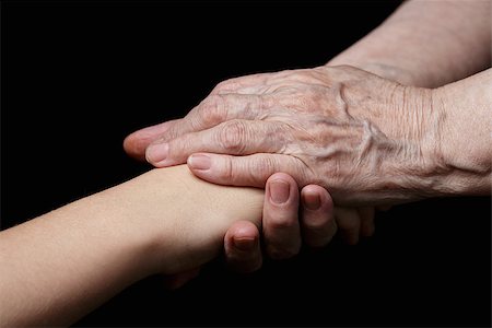granddaughter and grandmother holding hands, support theme Stock Photo - Budget Royalty-Free & Subscription, Code: 400-07294759