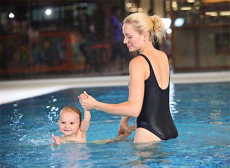 Young cheerful mother and little son in a swimming pool Stock Photo - Budget Royalty-Free & Subscription, Code: 400-07294806