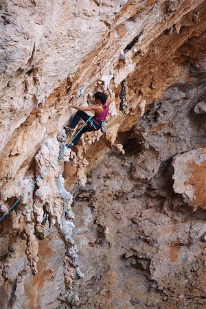 simsearch:400-07292725,k - Female rock climber on a cliff face Photographie de stock - Aubaine LD & Abonnement, Code: 400-07294800