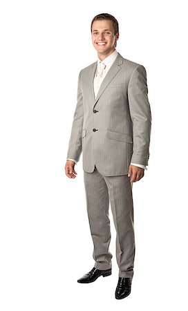 simsearch:400-06795988,k - Full length of a young man in a suit smiling brightly Foto de stock - Super Valor sin royalties y Suscripción, Código: 400-07294822