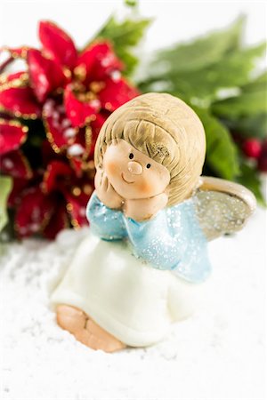 Holy baby Angel with poinsettia - Christmas symbols Stock Photo - Budget Royalty-Free & Subscription, Code: 400-07294979