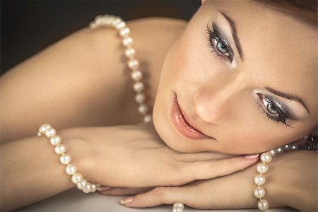 simsearch:400-04107736,k - The dreaming woman with a pearl necklace on the bared shoulders Stock Photo - Budget Royalty-Free & Subscription, Code: 400-07295015
