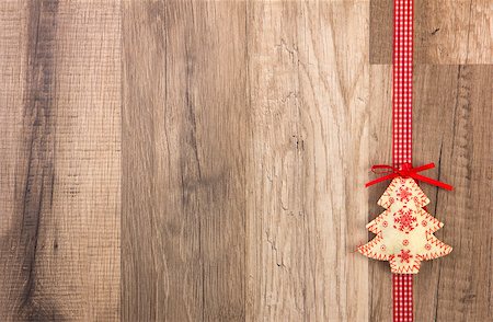 simsearch:400-07920008,k - Christmas decoration with wood background, Christmas tree red with ribbon Fotografie stock - Microstock e Abbonamento, Codice: 400-07295429