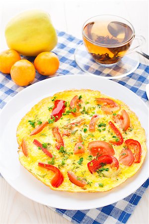 Omelet with paprika, tomato and herbs on a plate Stock Photo - Budget Royalty-Free & Subscription, Code: 400-07295455