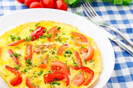 Omelet with paprika, tomato and herbs on a plate Stock Photo - Budget Royalty-Free & Subscription, Code: 400-07295457