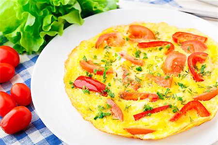 Omelet with paprika, tomato and herbs on a plate Stock Photo - Budget Royalty-Free & Subscription, Code: 400-07295459