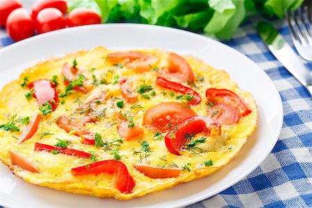 Omelet with paprika, tomato and herbs on a plate Stock Photo - Budget Royalty-Free & Subscription, Code: 400-07295464