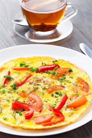 Omelet with paprika, tomato and herbs on a plate Stock Photo - Budget Royalty-Free & Subscription, Code: 400-07295461