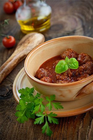 Italian cooking  - meat balls with basil, tomatoes, olive oil and garlic Stock Photo - Budget Royalty-Free & Subscription, Code: 400-07295554