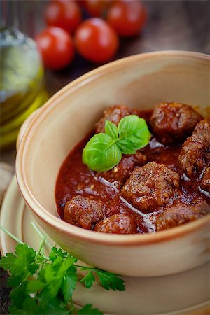 Italian cooking  - meat balls with basil, tomatoes, olive oil and garlic Stock Photo - Budget Royalty-Free & Subscription, Code: 400-07295555