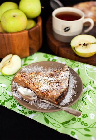 simsearch:400-07295671,k - Piece of homemade apple pie with apples and cup of tea on the background Photographie de stock - Aubaine LD & Abonnement, Code: 400-07295677