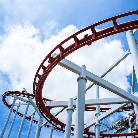 simsearch:400-05222693,k - Rollercoaster ride with sky at theme park Photographie de stock - Aubaine LD & Abonnement, Code: 400-07295720