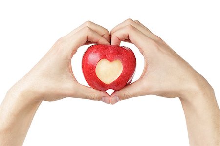 adult man hands holding apple with carved heart, isolated on white Stock Photo - Budget Royalty-Free & Subscription, Code: 400-07296282
