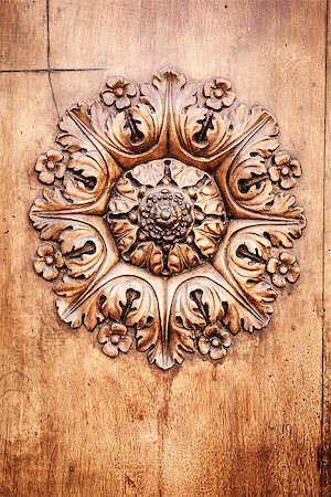 A beautiful wooden rose on a door in Tuscany Italy Stock Photo - Budget Royalty-Free & Subscription, Code: 400-07296337