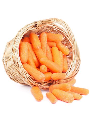 simsearch:400-06485810,k - Heap of Fresh Raw Peeled Baby Carrots in Wicker Basket isolated on white background Fotografie stock - Microstock e Abbonamento, Codice: 400-07296390