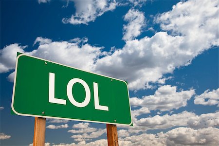 simsearch:614-06168944,k - LOL, Texting Abbreviation for Laughing Out Loud, Green Road Sign with Dramatic Sky and Clouds. Foto de stock - Super Valor sin royalties y Suscripción, Código: 400-07297076