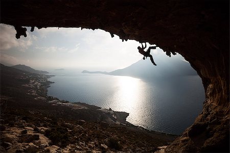 simsearch:400-07292725,k - Silhouette of a rock climber at sunset. Kalymnos Island, Greece Photographie de stock - Aubaine LD & Abonnement, Code: 400-07297441