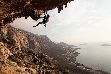 simsearch:400-07292725,k - Silhouette of a rock climber at sunset. Kalymnos Island, Greece Photographie de stock - Aubaine LD & Abonnement, Code: 400-07297442