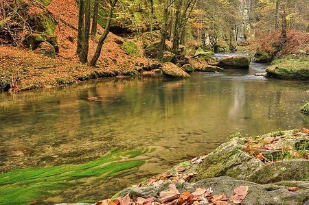 simsearch:400-05293137,k - A small river flows through a wild landscape with rocks Fotografie stock - Microstock e Abbonamento, Codice: 400-07297519