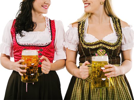 simsearch:400-07124078,k - Photo of two woman wearing traditional dirndl and drinking beer. Stockbilder - Microstock & Abonnement, Bildnummer: 400-07298215