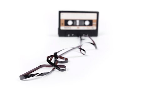 simsearch:400-06357261,k - retro cassette with loose tape over a white background Stock Photo - Budget Royalty-Free & Subscription, Code: 400-07298339