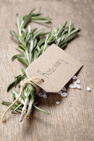 plant tag - fresh rosemary bunch, on wooden table Stock Photo - Budget Royalty-Free & Subscription, Code: 400-07298803