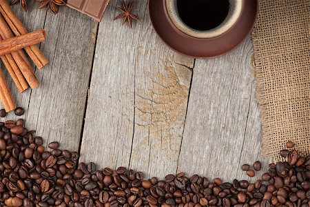 simsearch:400-04849433,k - Coffee cup, spices and chocolate on wooden table texture with copy space. View from above Photographie de stock - Aubaine LD & Abonnement, Code: 400-07299275