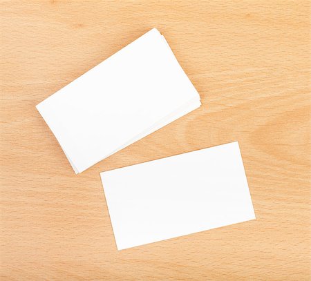 Blank business cards on wooden office table Stock Photo - Budget Royalty-Free & Subscription, Code: 400-07299287