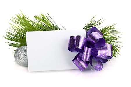 Empty gift card and christmas decor. Isolated on white background Stock Photo - Budget Royalty-Free & Subscription, Code: 400-07299327