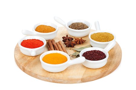 simsearch:400-08053136,k - Various spices selection on cutting board. Isolated on white background Photographie de stock - Aubaine LD & Abonnement, Code: 400-07299417