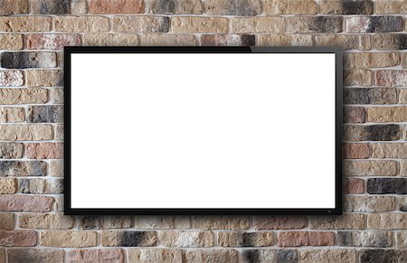 flat screen tv on wall - TV display on old brick wall background Stock Photo - Budget Royalty-Free & Subscription, Code: 400-07299442