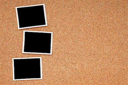 family photos in album - Polaroid photo frames on cork texture background with copyspace Stock Photo - Budget Royalty-Free & Subscription, Code: 400-07299476