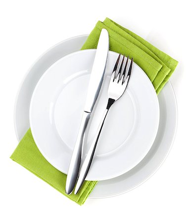 simsearch:824-07310346,k - Silverware or flatware set of fork, spoons and knife on plates. Isolated on white background Foto de stock - Super Valor sin royalties y Suscripción, Código: 400-07299498