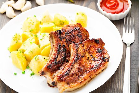 Fried pork loin with potato on a plate Stock Photo - Budget Royalty-Free & Subscription, Code: 400-07299559