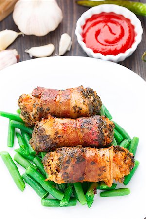 Delicious bacon wrapped cutlet with green beans Stock Photo - Budget Royalty-Free & Subscription, Code: 400-07299565