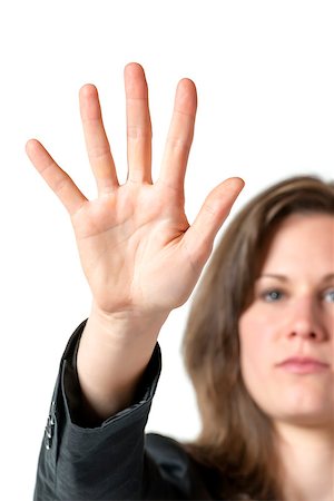 simsearch:400-06635276,k - Business woman in black suit holds her hand up to stop someone or something, isolated on white background Photographie de stock - Aubaine LD & Abonnement, Code: 400-07299600