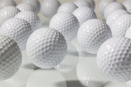 simsearch:400-07218310,k - Different golf balls on a glass table Photographie de stock - Aubaine LD & Abonnement, Code: 400-07299681