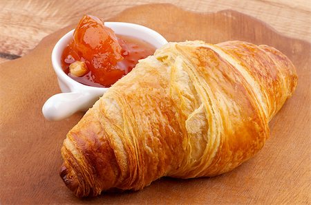 simsearch:400-07420117,k - Freshly Baked Croissant and Apricot Jam on Wooden Plate closeup Stock Photo - Budget Royalty-Free & Subscription, Code: 400-07299904