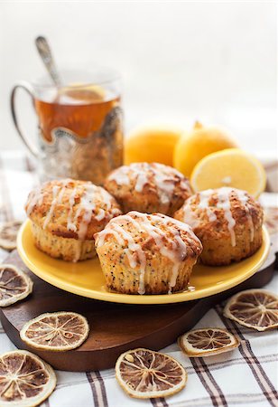 simsearch:400-07917638,k - Plate of fresh lemon poppy seed muffins with icing Stock Photo - Budget Royalty-Free & Subscription, Code: 400-07299928