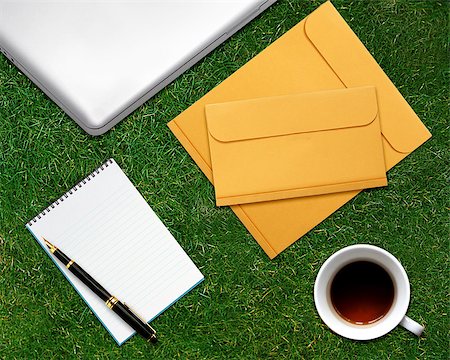 simsearch:400-08378888,k - business desktop with laptop, notepad, envelops and coffee on grassland. Stock Photo - Budget Royalty-Free & Subscription, Code: 400-07290371