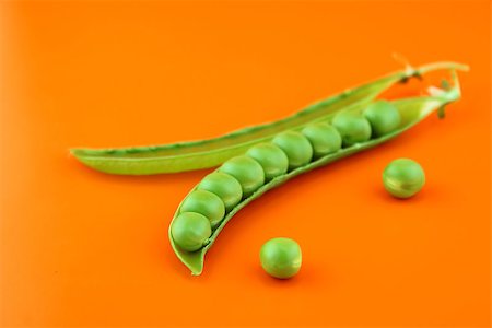 pod peas - fresh pea fruit on orange background . Stock Photo - Budget Royalty-Free & Subscription, Code: 400-07290465