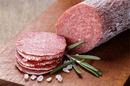 simsearch:400-06852716,k - italian salami sausage slices with rosemary and sea salt, wood board Stockbilder - Microstock & Abonnement, Bildnummer: 400-07291395