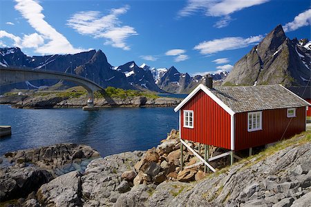 sakrisoy - Traditional red fishing rorbu hut on Lofoten islands in Norway near bridge connecting islands Photographie de stock - Aubaine LD & Abonnement, Code: 400-07291604