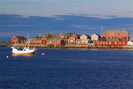 Red fishing rorbu huts and fishing boat in town of Reine on Lofoten islands Photographie de stock - Aubaine LD & Abonnement, Code: 400-07291609