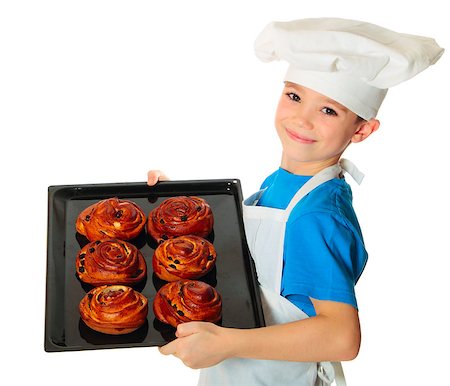 paleka (artist) - Six years old cook boy holding baking tray with fresh buns in the hand isolated on white Foto de stock - Super Valor sin royalties y Suscripción, Código: 400-07291853