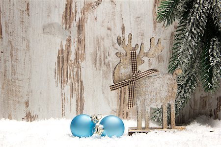 elk on snow - christmas decoration with wood background, snow, elk, christmas baubles blue and fir branch Stock Photo - Budget Royalty-Free & Subscription, Code: 400-07291894