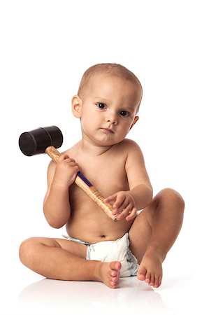 simsearch:400-08835171,k - Cute little boy with a hammer over white background Photographie de stock - Aubaine LD & Abonnement, Code: 400-07292889