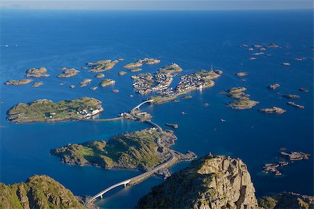 Scenic town of Henningsvaer on Lofoten islands in Norway with large fishing harbour and bridges connecting rocky islands Stockbilder - Microstock & Abonnement, Bildnummer: 400-07292964